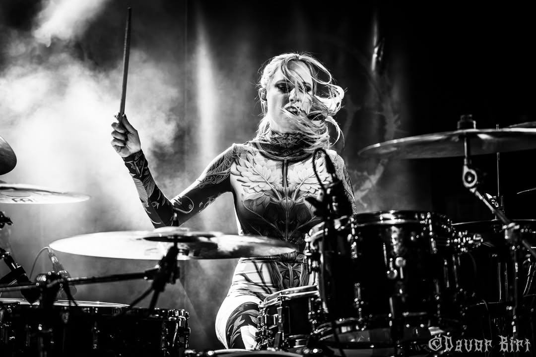 Anna Mylee playing drums live on stage